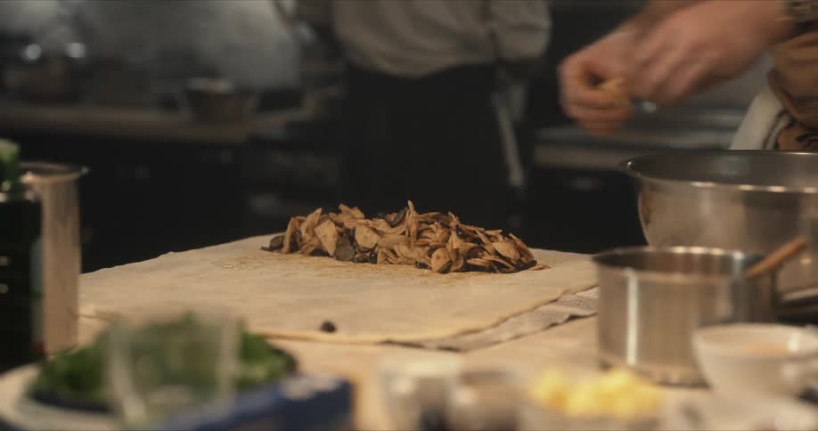 A person cooking food in a kitchen