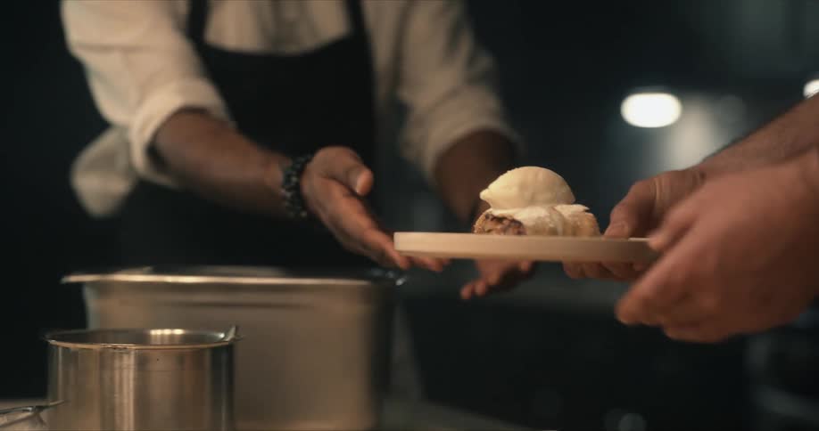 Two cooks serving up food
