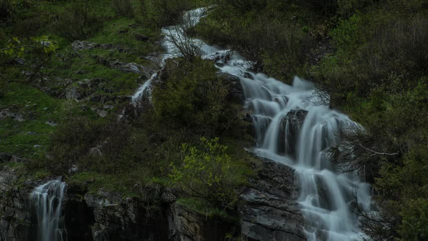 Water flows down the mountain and over the rocks
