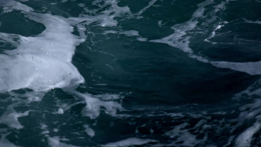 White foam forms on top of the waves