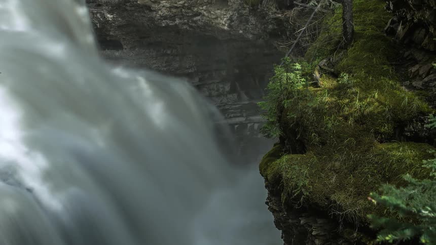Water cascades over rocks in the wilderness
