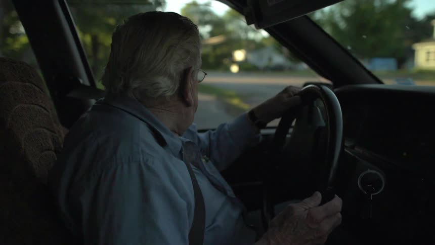 An old man is driving