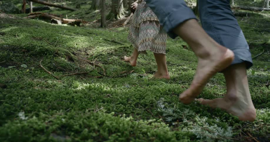 Two people are hiking in the forest