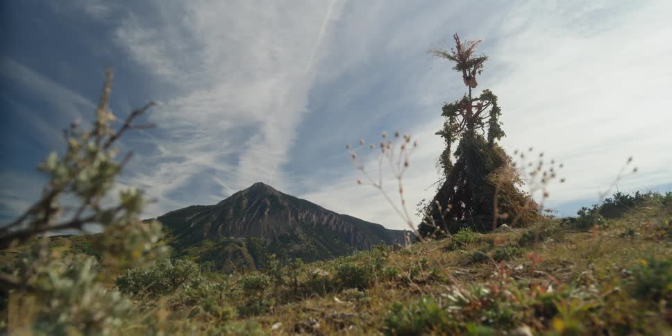 Past the hill is a mountain range