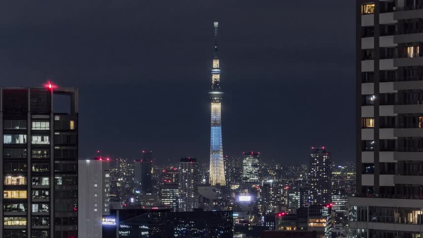 The buildings are brightly lit at night