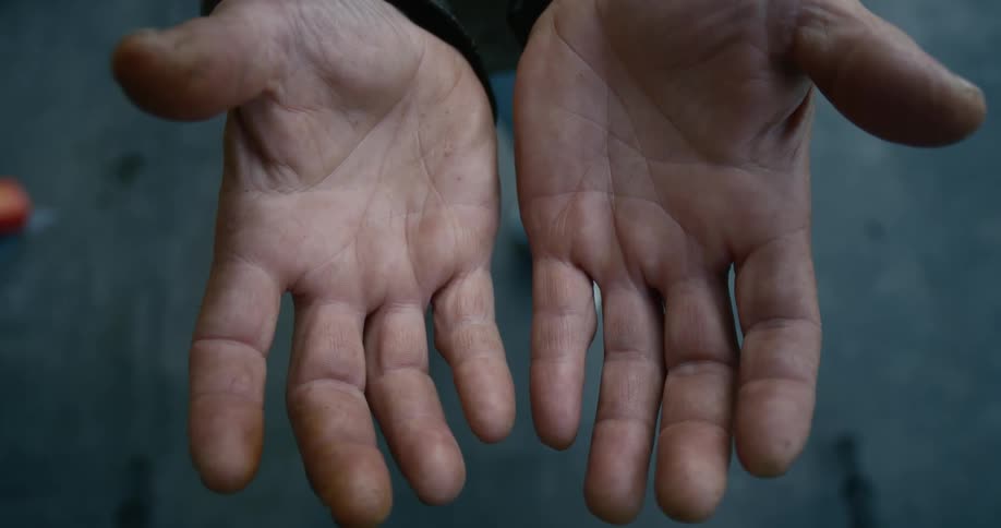 Two caucasian hands outstretched with the palms facing up