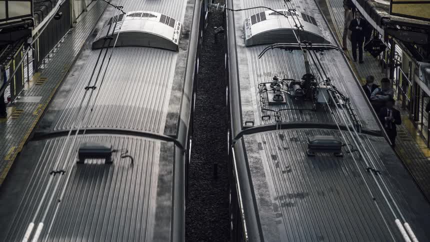 Pedestrians get on and off the train