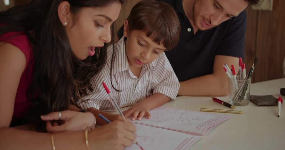 Parents are drawing with their son
