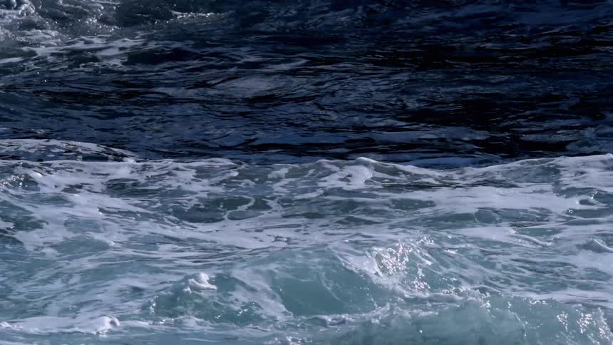 Ocean water splashes and churns