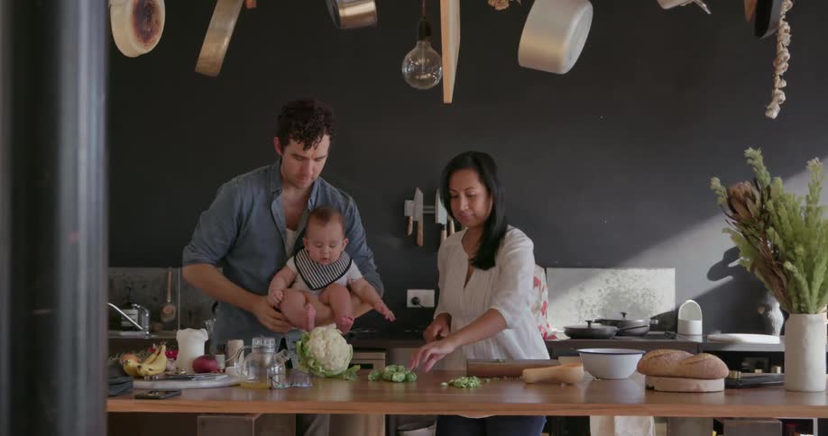 A family prepares dinner in the kitchen