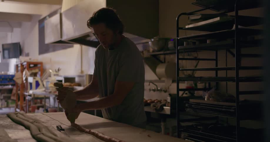 People are working in a kitchen together