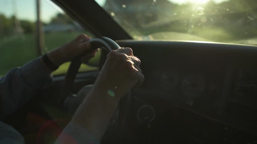 A person drives a car