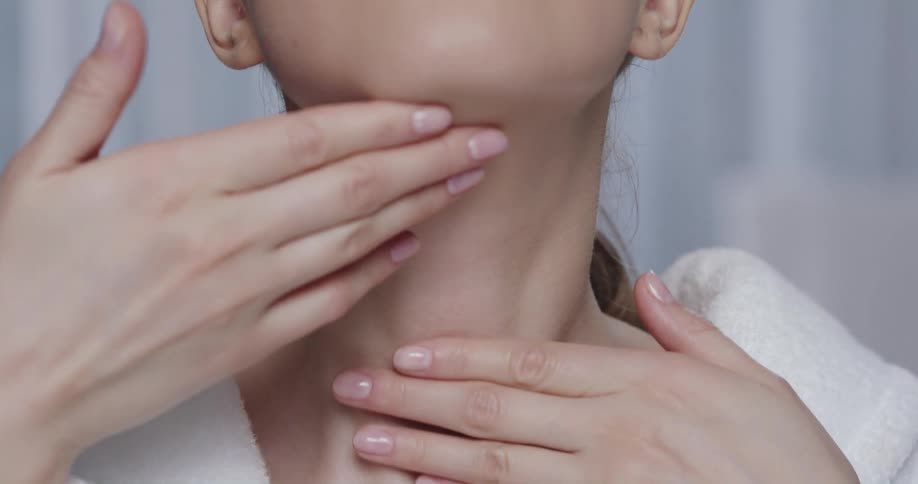 A model runs her fingers up her neck