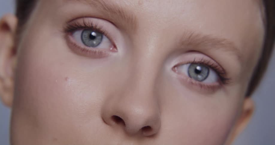 Close up view of a woman wearing makeup