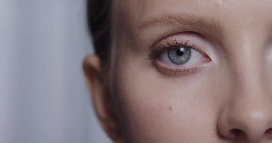Woman opens her eye and stares