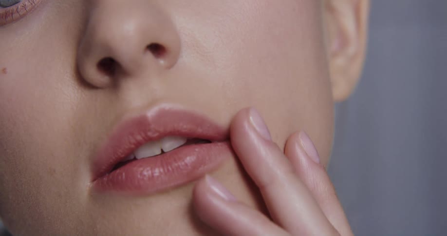 A woman is modeling and wearing makeup