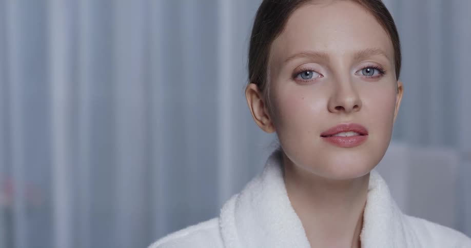 A woman model is posing for the camera indoors