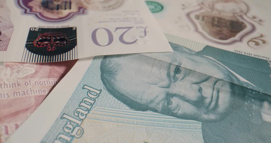 English money sits spread out on a table
