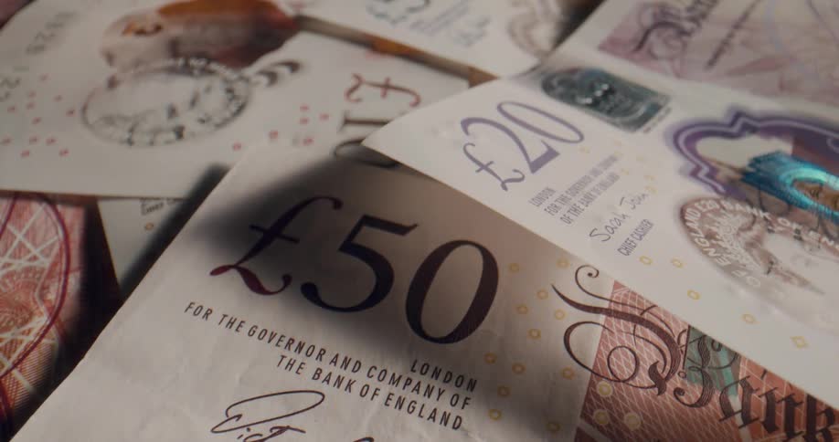 Pound currency paper money lies together
