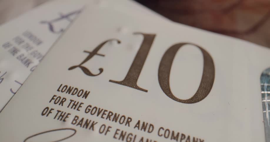 English paper currency lies close on surface