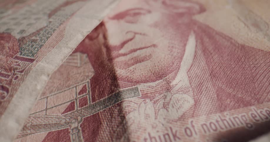 Close up of the artwork on various england bank notes