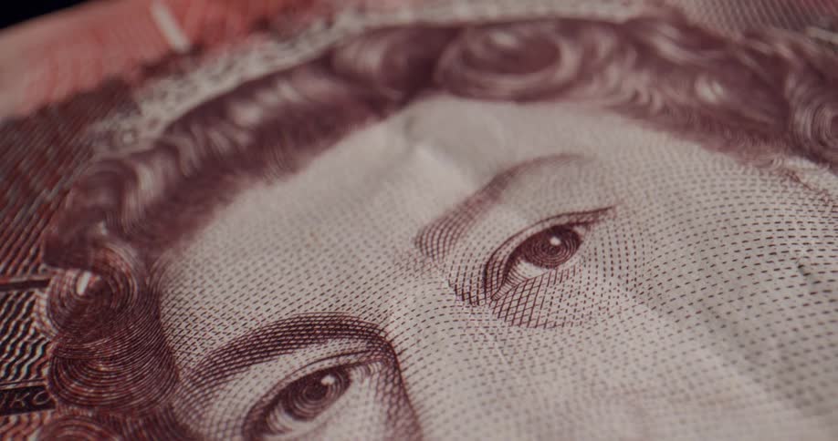 A portrait of the queen on a british banknote