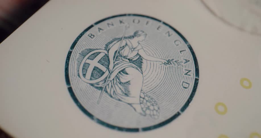 The seal of the bank of england on a banknote