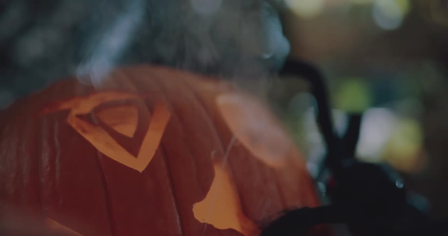 Smoke emerges from the eyes of a jack olantern