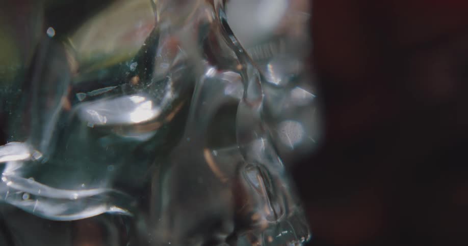 Close up of the silver surface of a toy decoraive skull