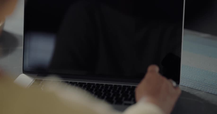 A person is typing on their tablet
