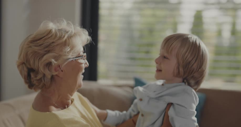 A grandmother and grandson hugging