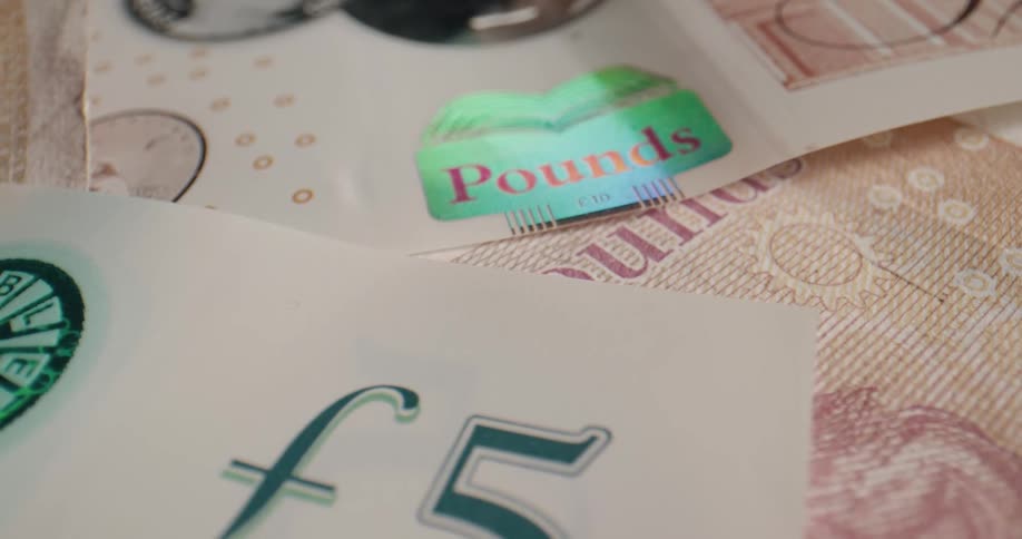 British banknotes lying in a pile