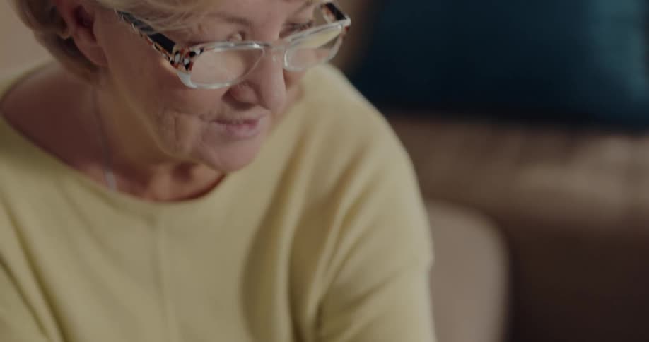 Old woman is talking on the phone