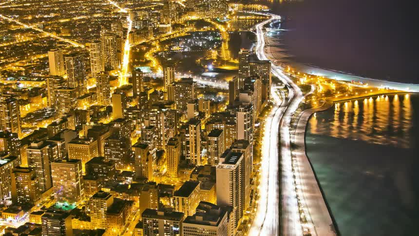 Aerial view of city skyscrapers and traffic at night