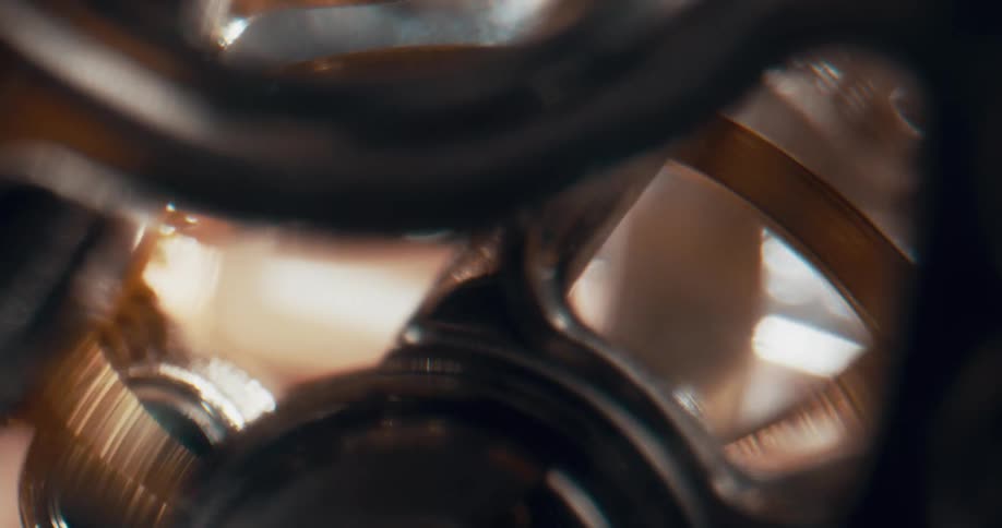 Metal circular piece spins back and forth in machine