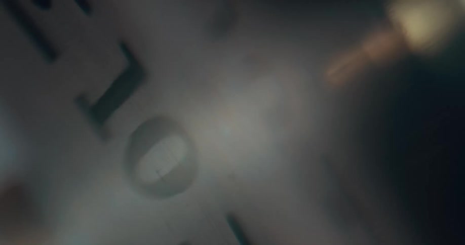 Light shines over the close up of the numbers on a dial