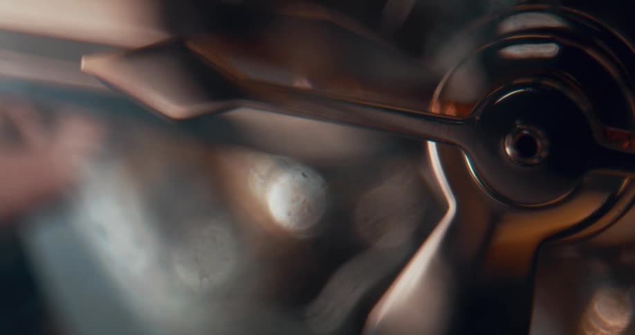 Close up of the moving gears on the functioning mechanism of an analog clock