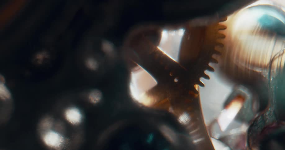 The cogs and gears of a machine move and tick away