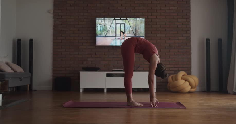 Young woman stretching and doing yoga