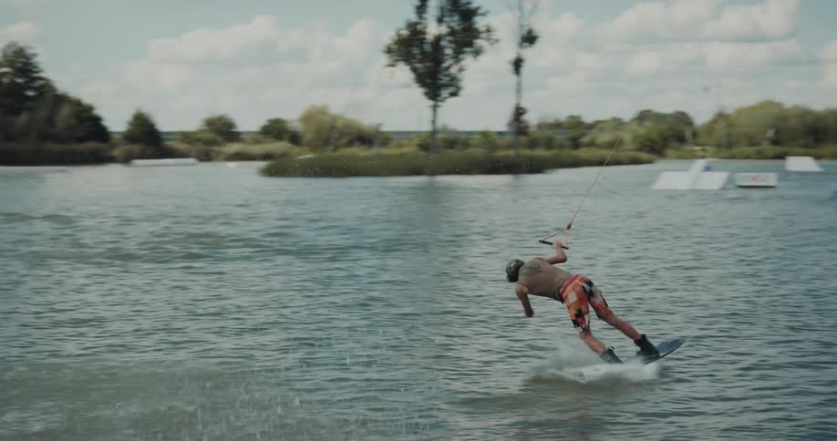 A man wakeboards in the lake