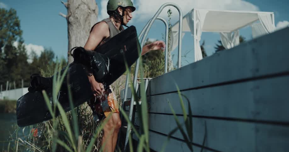 Young man is outside in the water