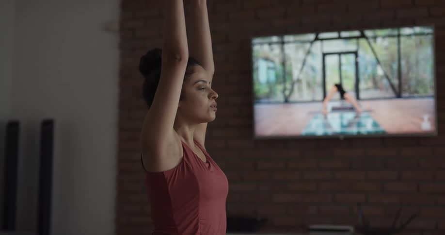 Young woman is doing some yoga