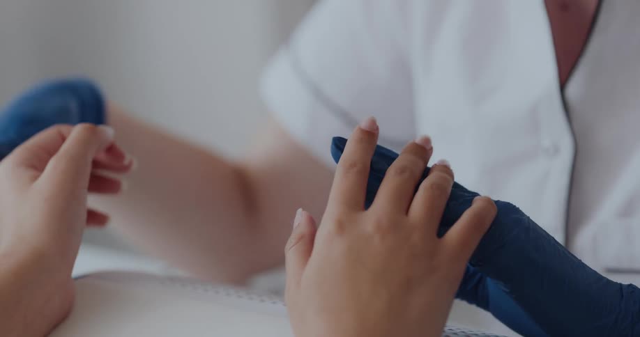 A person is receiving a manicure