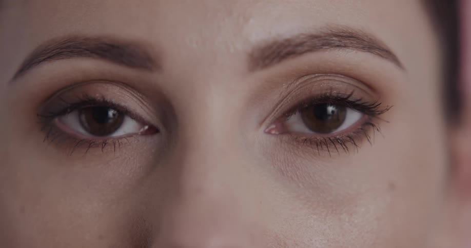 Close up of female models brown eyes staring at camera