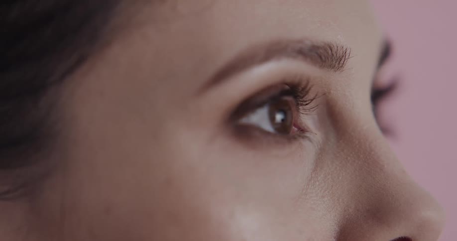 A woman blinks her eyes