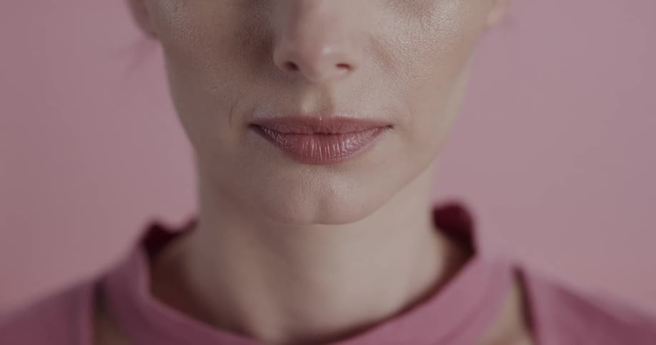 A woman gives a large smile