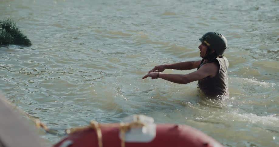 A young man swimming in the water