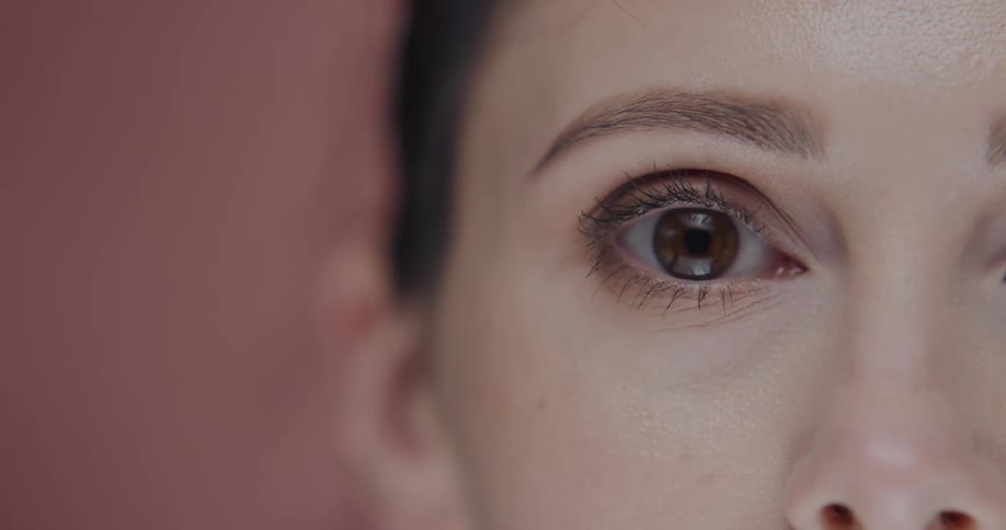 Close up view of a womans face is displayed on camera