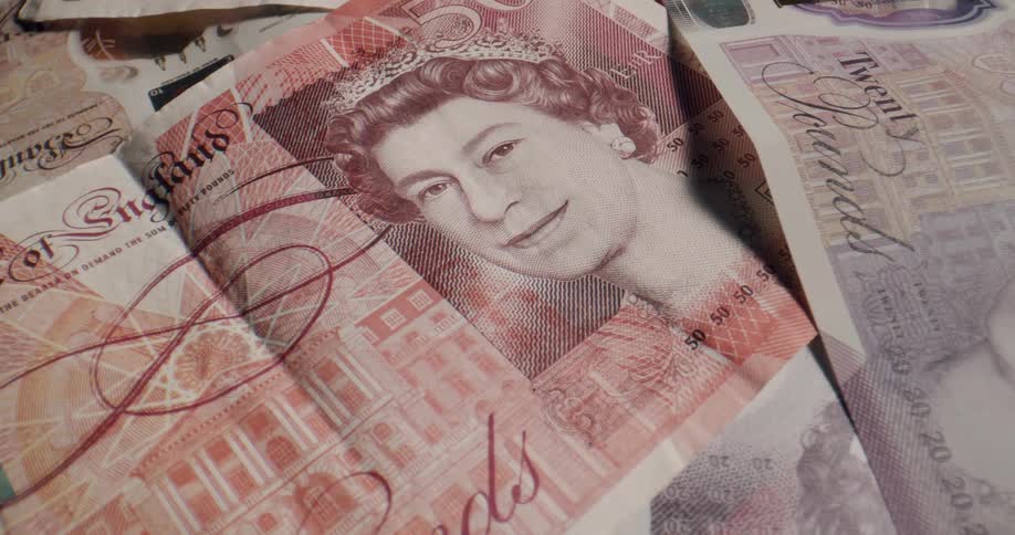 Close up of the artwork on various england bank notes