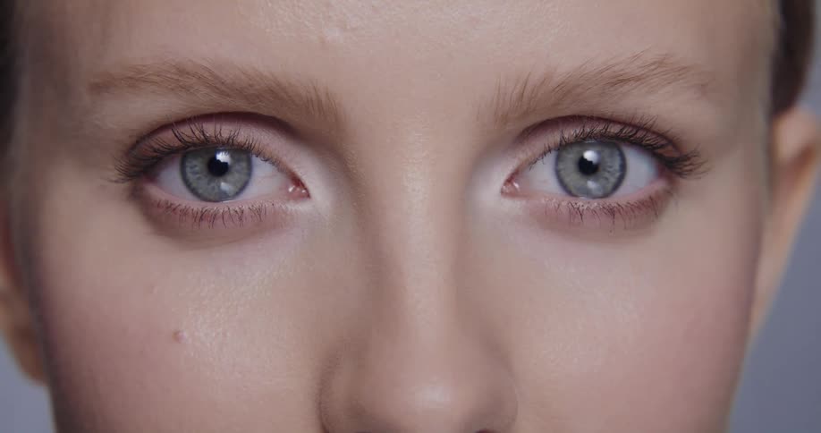 Close up view of a female face is displayed